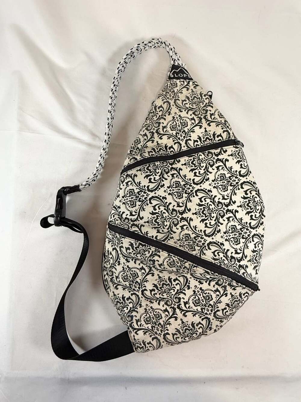 Slope Sling Bag Backpack Black Cream Damask Print Canvas Rope Strap Crossbody Go